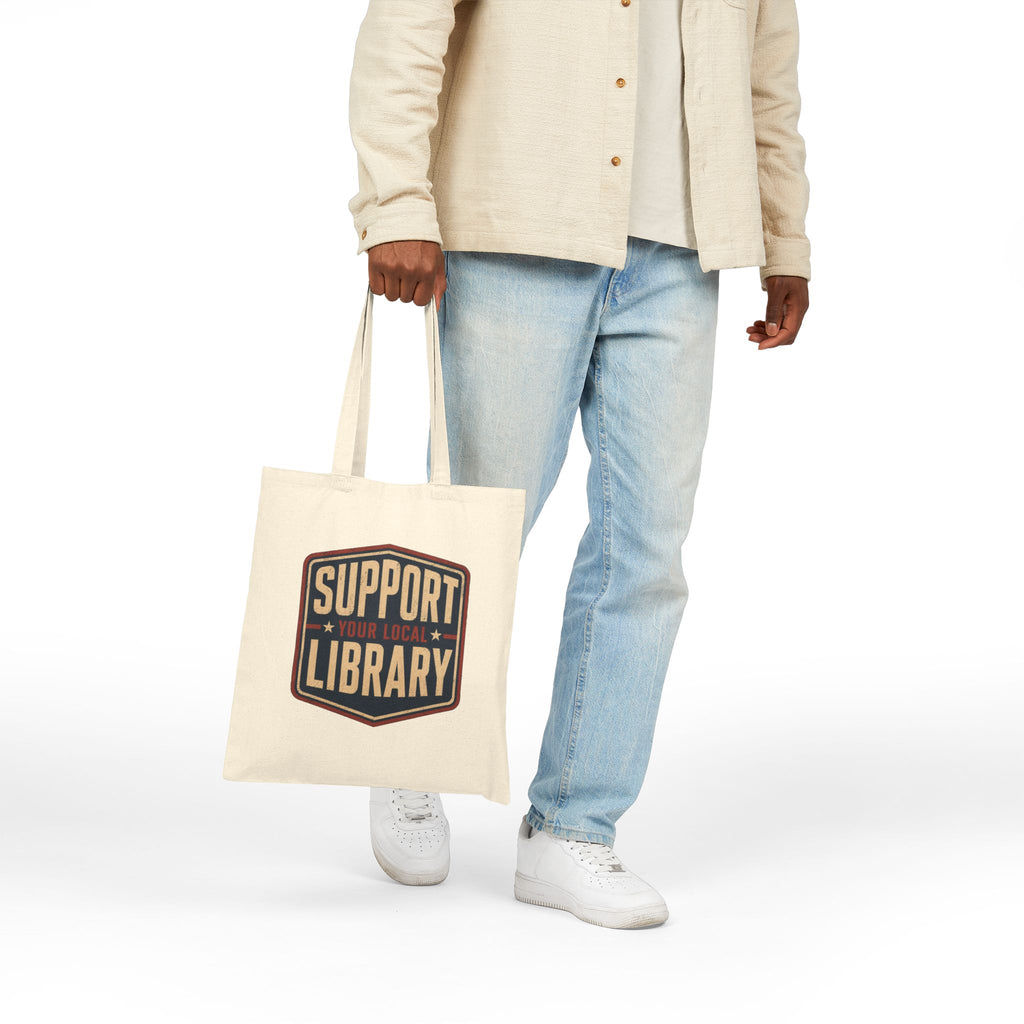 Person carrying a tote bag with the phrase Support Your Local Library graphic