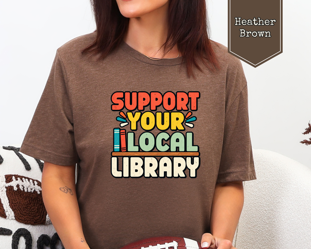 Woman wearing Heather Stone Support Your Local Library retro librarian tee.