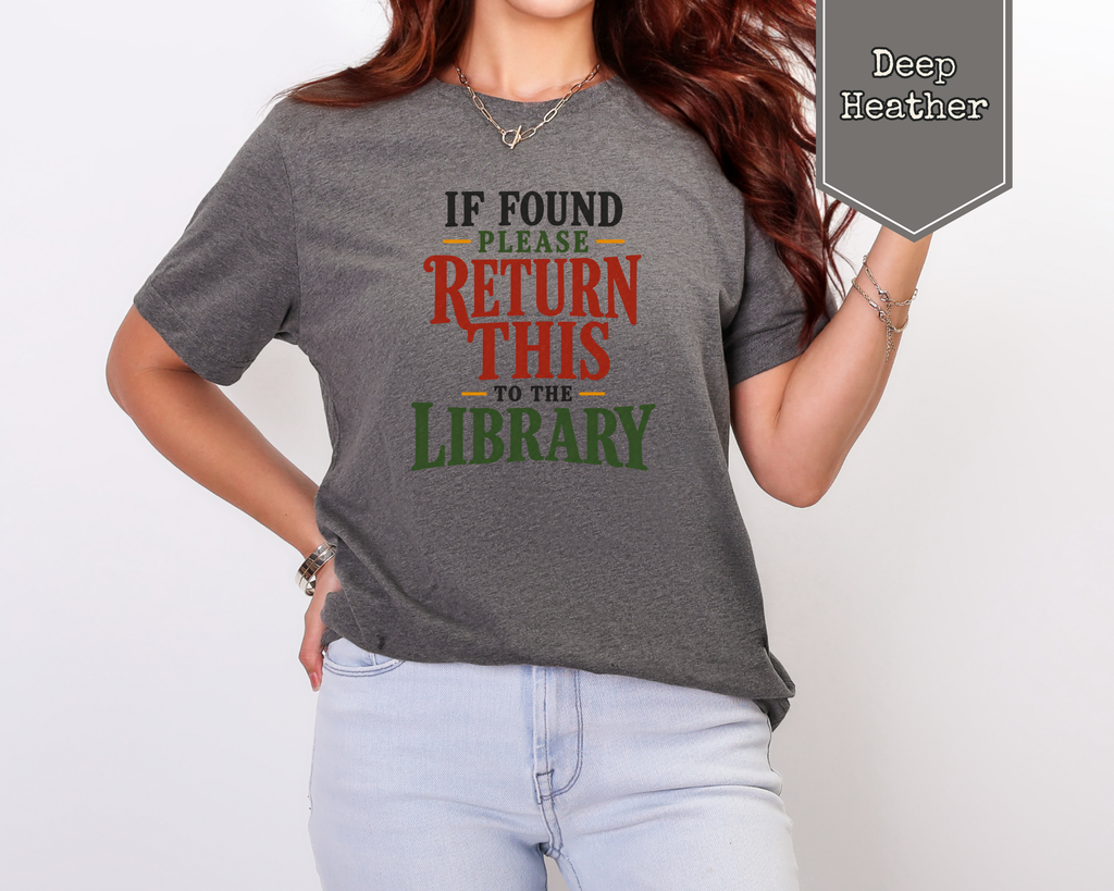 Model wearing Heather Peach literary humor graphic tee sitting in café.