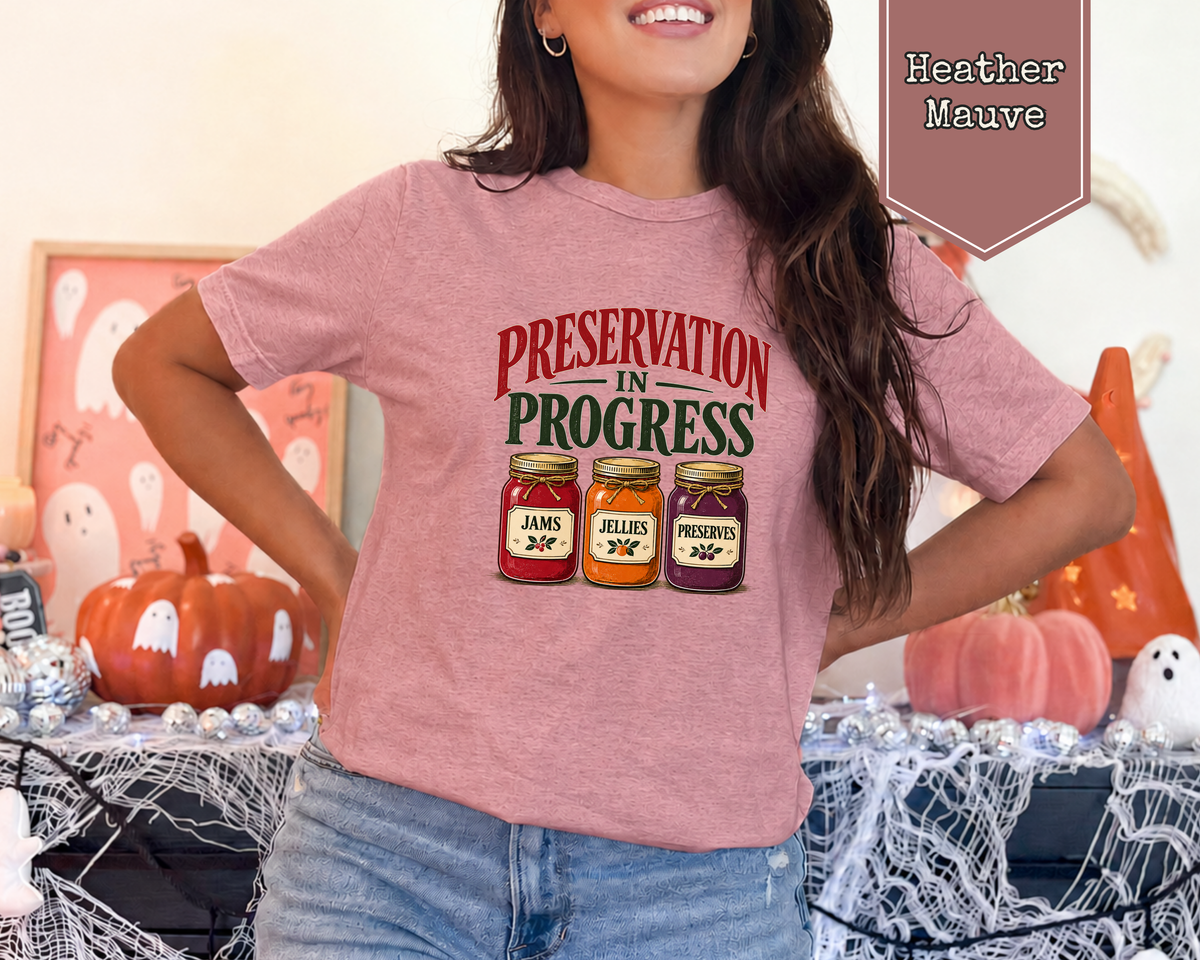 Woman wearing Heather Dust Preservation in Progress preserves jar graphic tee.