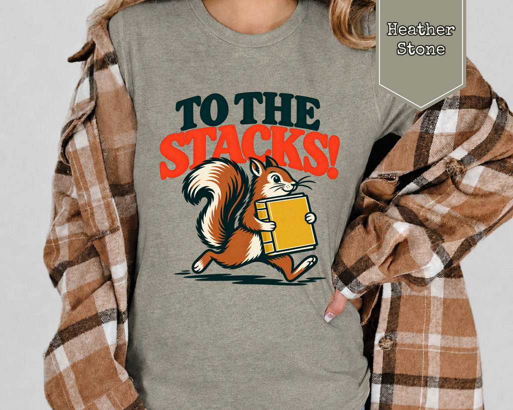 Woman wearing Heather Stone retro squirrel library graphic t-shirt paired with jeans.
