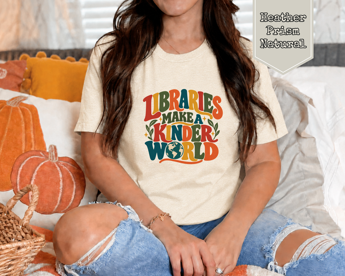 Man wearing Heather Brown Libraries Make a Kinder World library advocacy graphic tee.