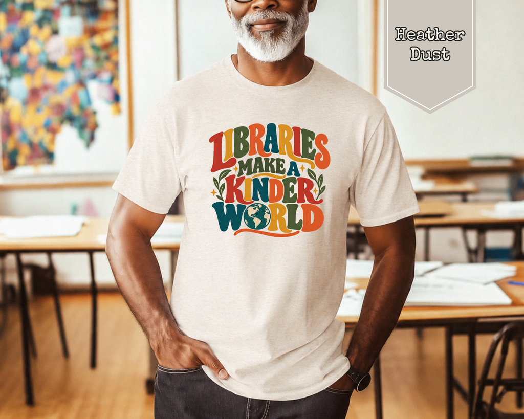 Woman wearing Heather Dust Libraries Make a Kinder World retro graphic tee with vintage typography and charming globe illustration.