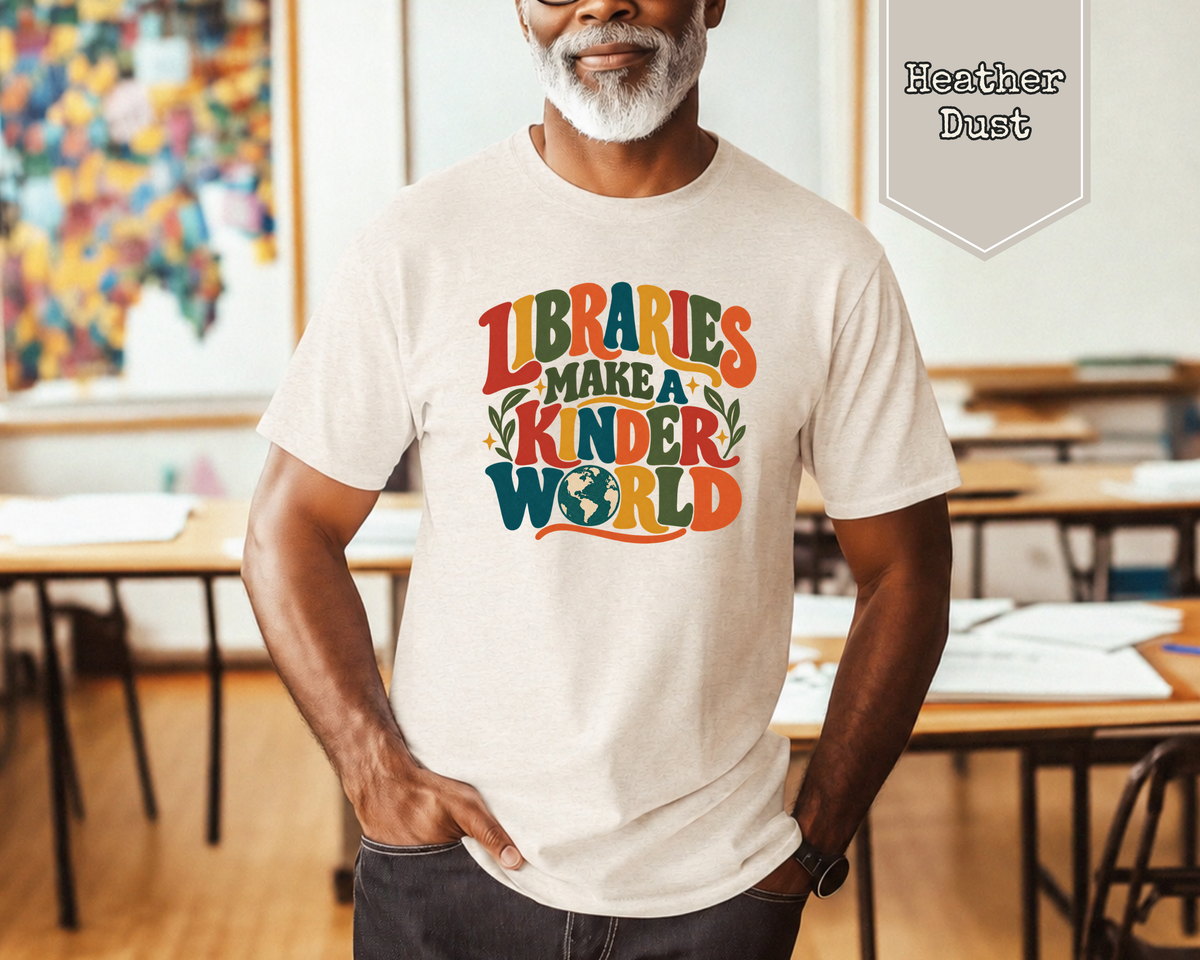 Woman wearing Heather Dust Libraries Make a Kinder World retro graphic tee with vintage typography and charming globe illustration.