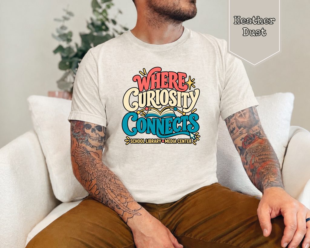 Man wearing Black Where Curiosity Connects media center specialist graphic tee.