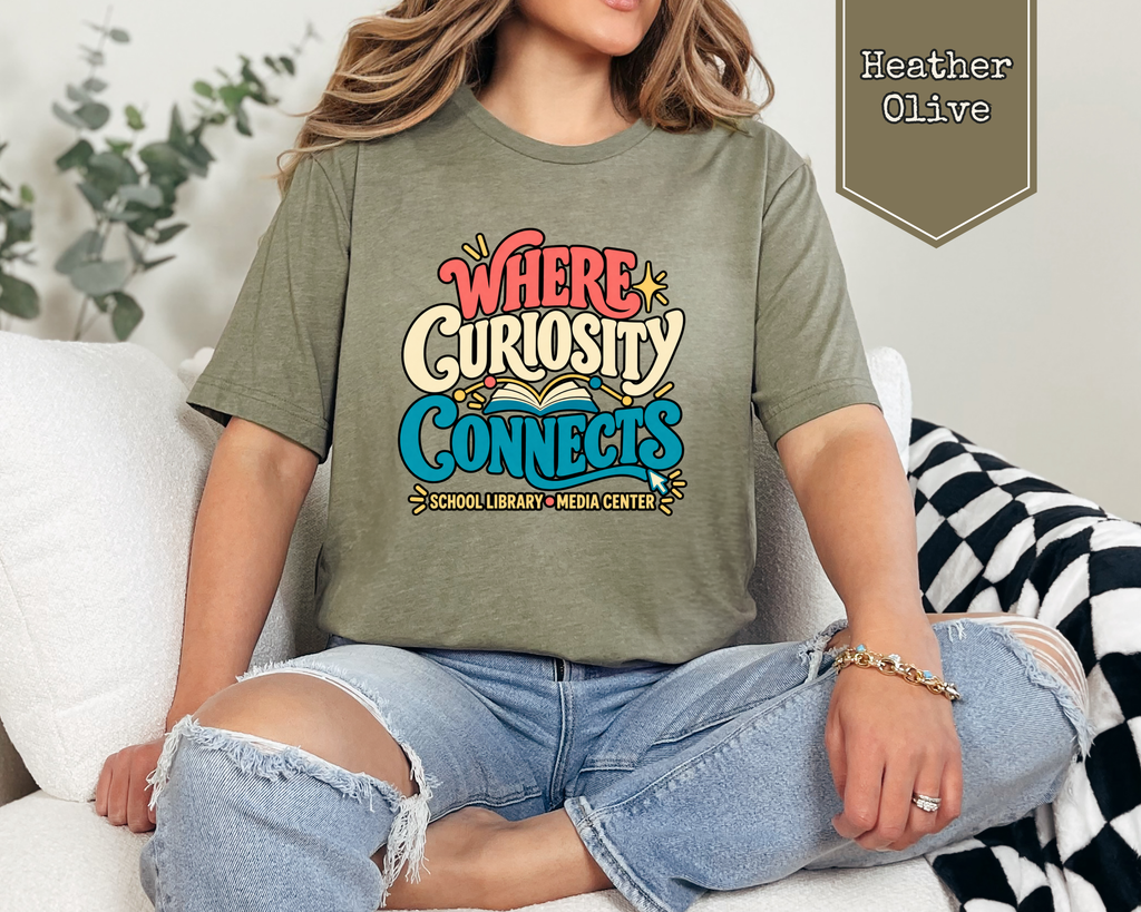 Person wearing Heather Prism Lilac Where Curiosity Connects unisex graphic t-shirt.