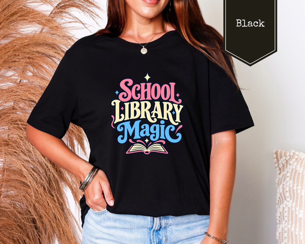 Woman wearing Heather Mint School Library Magic educator t-shirt in a colorful school library.