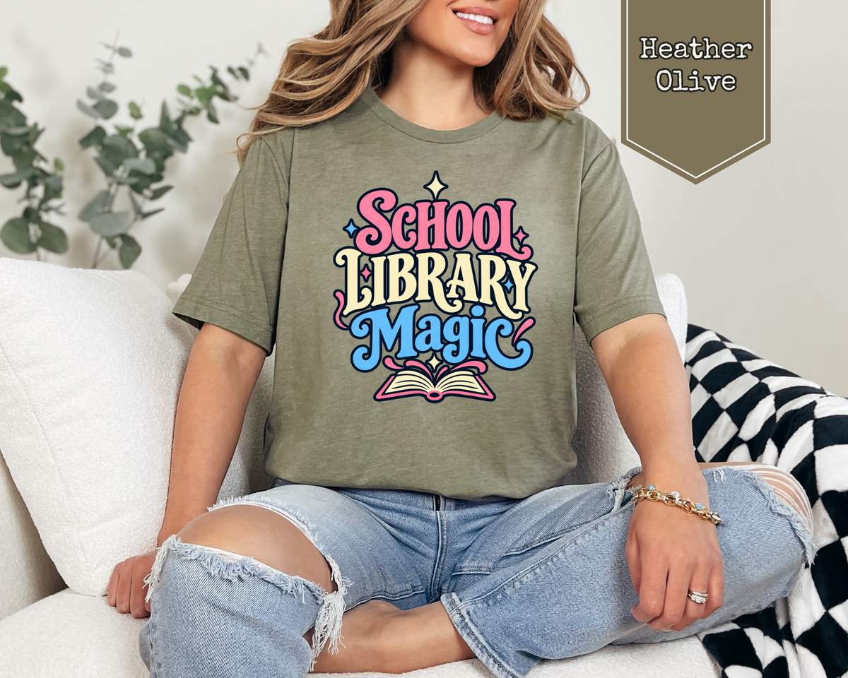 Person wearing Heather Prism Lilac School Library Magic unisex graphic t-shirt.