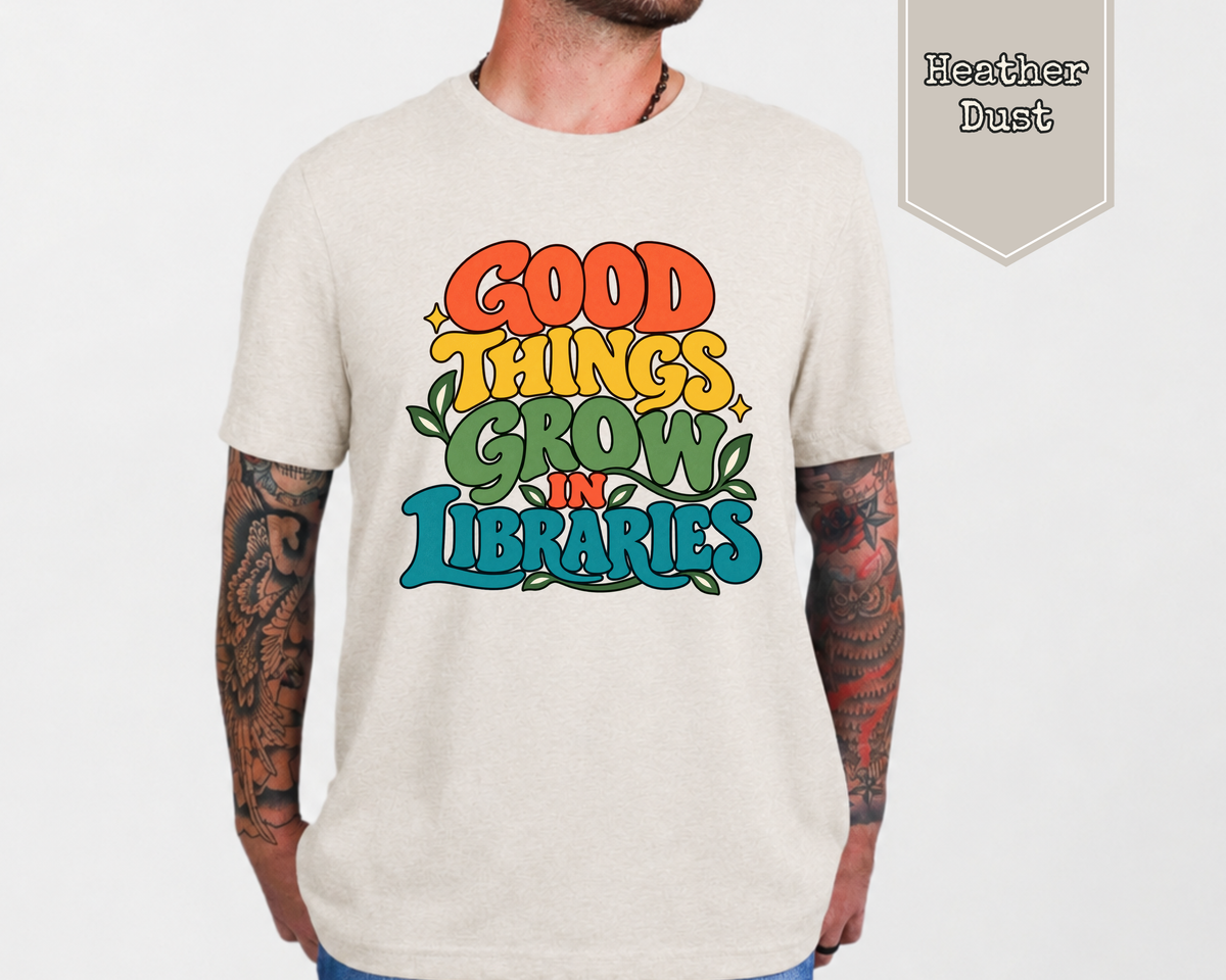 Woman wearing Heather Dust Good Things Grow in Libraries retro graphic tee with vintage typography and botanical illustration.
