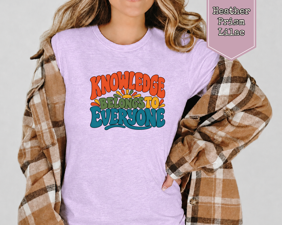 Model wearing Heather Prism Ice Blue Knowledge Belongs to Everyone retro librarian shirt.
