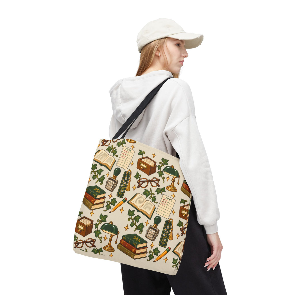 Woman wearing casual outfit carrying Vintage Library Essentials book lover pattern tote bag.