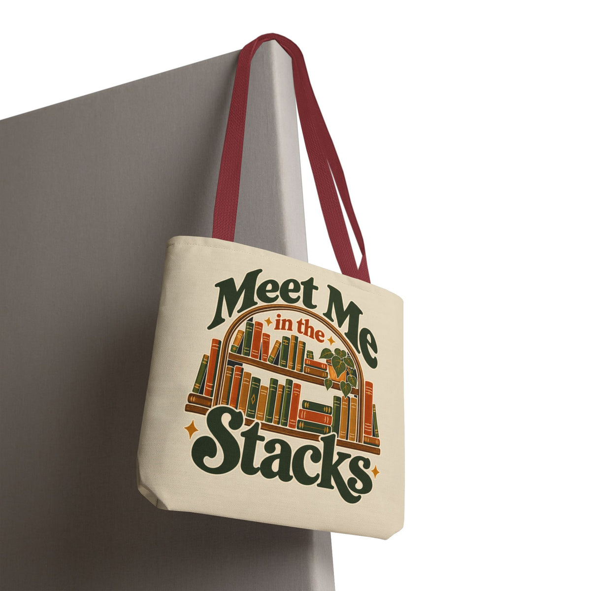 Close-up of durable reinforced double-stitched cotton handle on cream book tote.